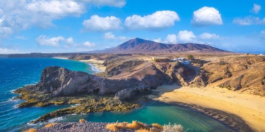 Turquoise waters in the sandy Papagayo beach in Lanzarote, Canary Islands, Spain