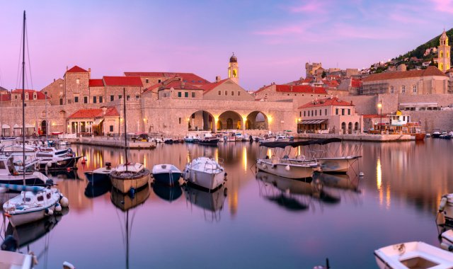 The old port of Dubrovnik surrounded by buildings in Croatia
