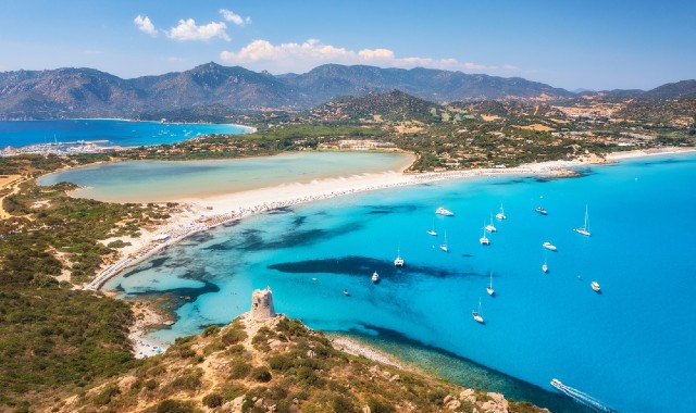 Aerial view of Sardinia’s Porto Giunco beach with clear blue waters