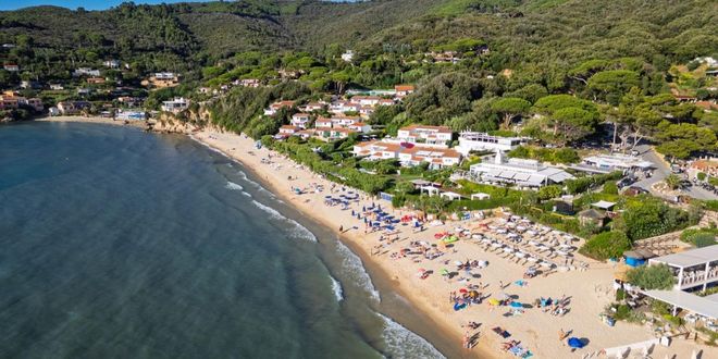The turquoise waters and sandy shore of Fetovaia Beach in Elba, Italy