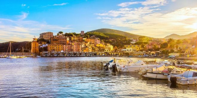 The harbor of Rio Marina with colorful buildings and boats on Elba island, Italy